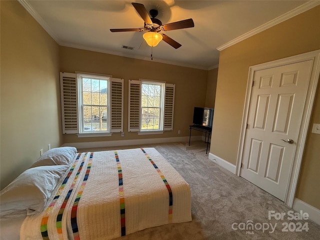 unfurnished bedroom featuring ceiling fan, light colored carpet, and ornamental molding