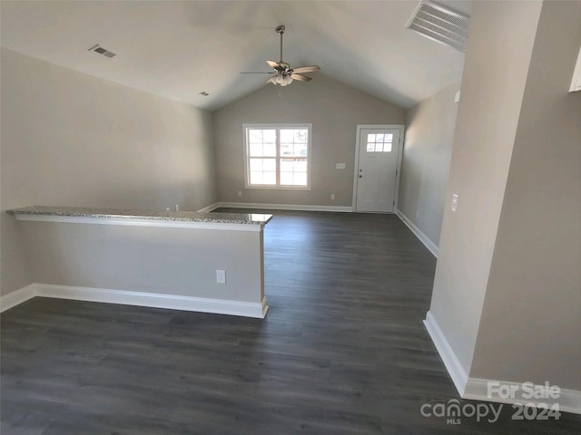 interior space featuring dark hardwood / wood-style floors, ceiling fan, and lofted ceiling