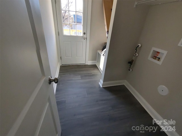 clothes washing area with hookup for a washing machine and dark hardwood / wood-style flooring