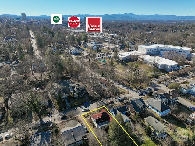 birds eye view of property with a mountain view