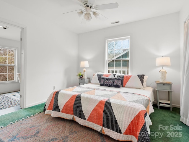 carpeted bedroom with ceiling fan