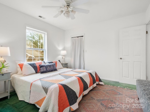 carpeted bedroom with ceiling fan