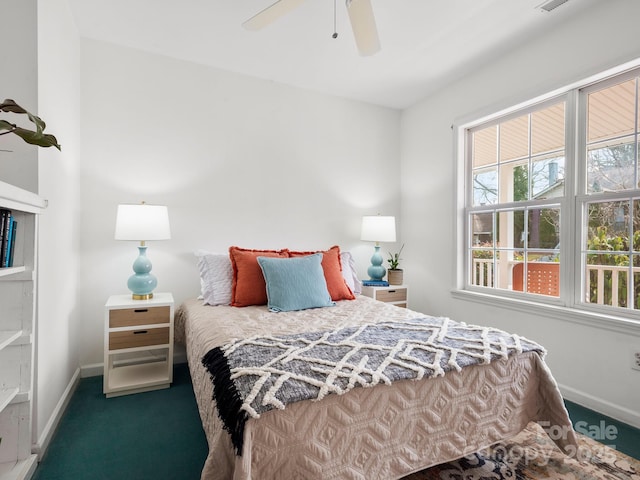 carpeted bedroom featuring ceiling fan