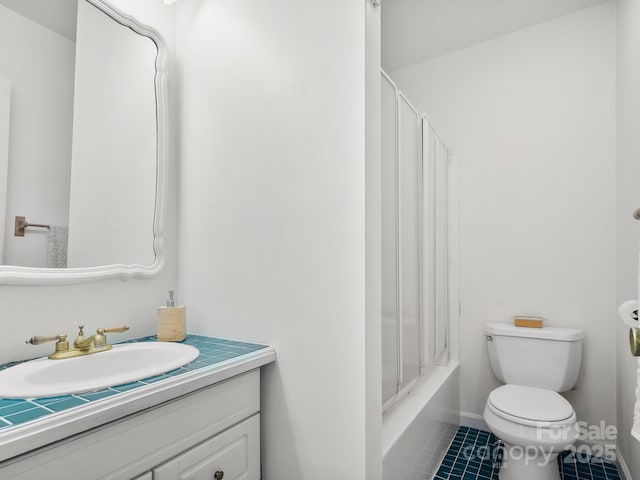 full bathroom with shower / bath combination, vanity, toilet, and tile patterned floors