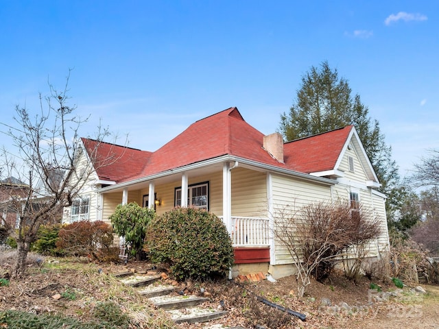 view of property exterior featuring a porch