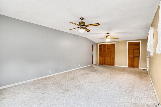 unfurnished room with a textured ceiling, light colored carpet, and ceiling fan