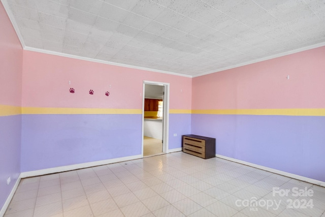 empty room featuring ornamental molding