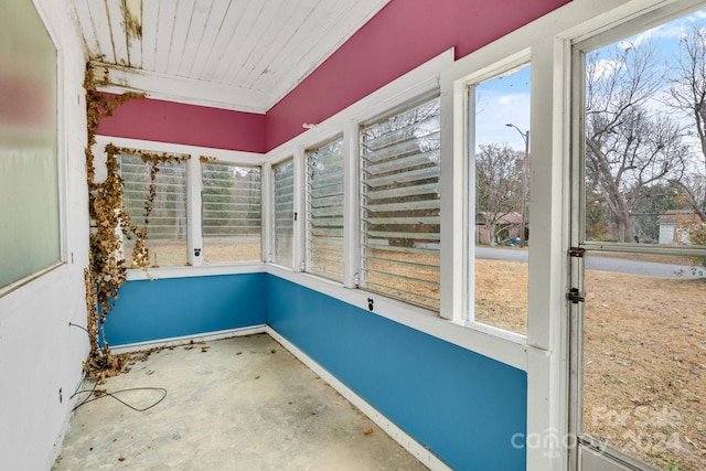 unfurnished sunroom with plenty of natural light