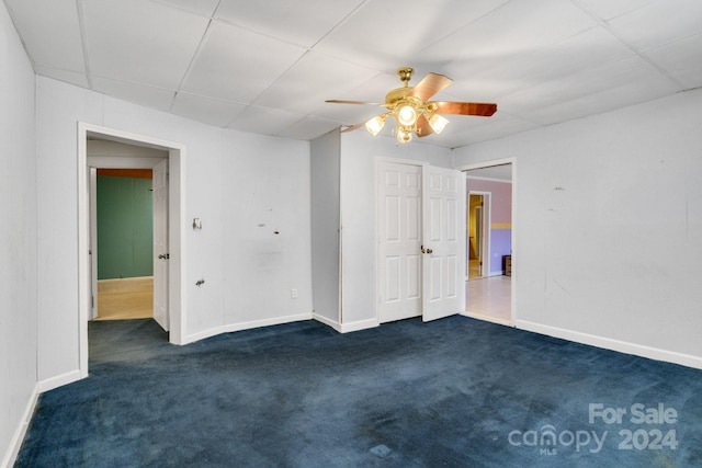 carpeted empty room with ceiling fan