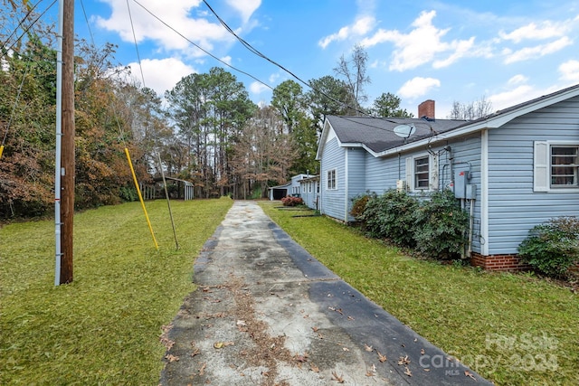 view of home's exterior featuring a yard