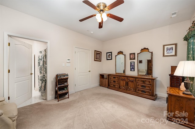 interior space with ceiling fan