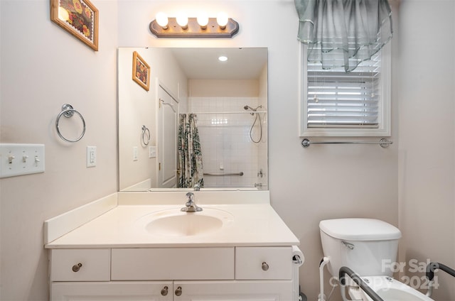 bathroom with vanity, toilet, and walk in shower