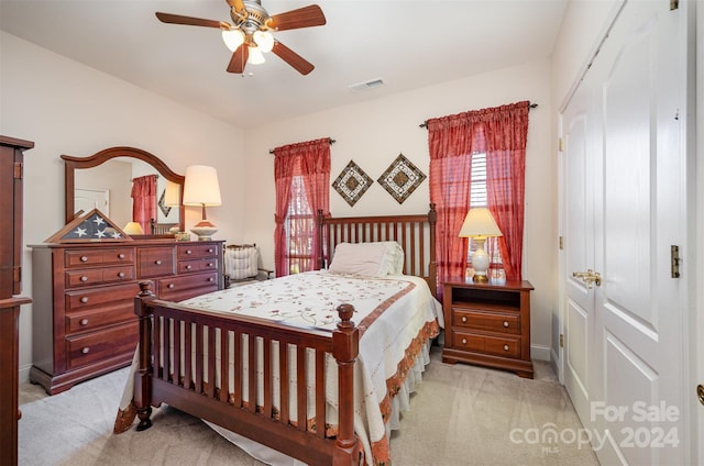 bedroom featuring ceiling fan and light colored carpet