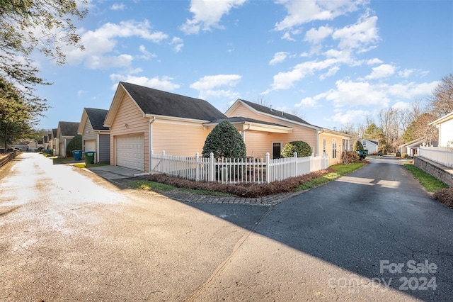 view of property exterior with a garage