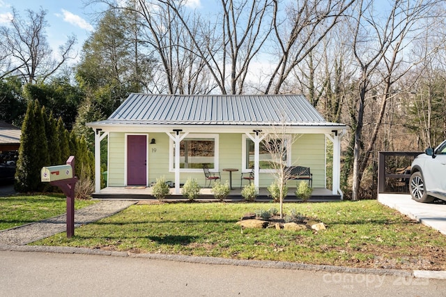 bungalow-style home with a porch and a front lawn