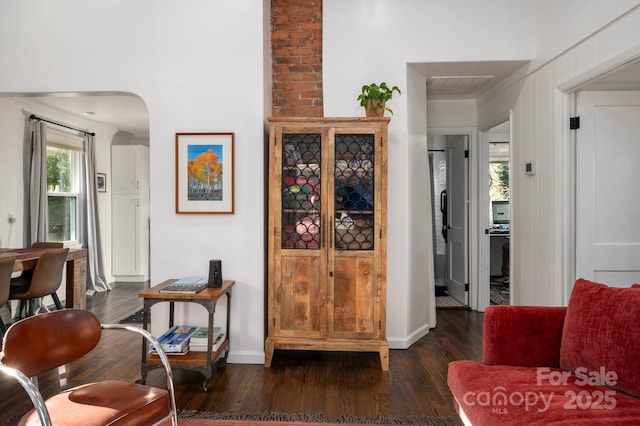 corridor with dark hardwood / wood-style floors