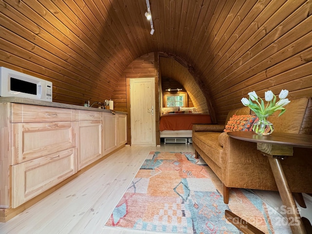 bonus room with lofted ceiling, wooden walls, light hardwood / wood-style flooring, and wooden ceiling