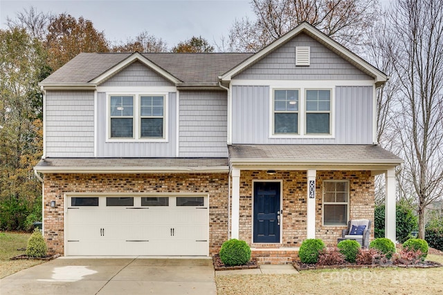 craftsman-style house featuring covered porch and a garage