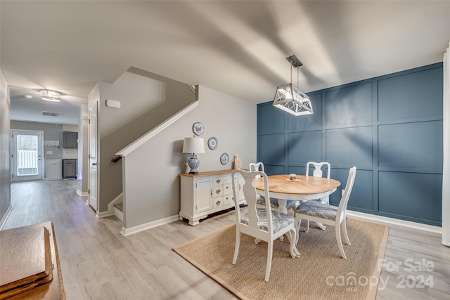 dining area with light wood-type flooring