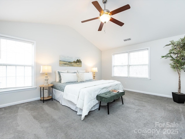 carpeted bedroom with ceiling fan and vaulted ceiling