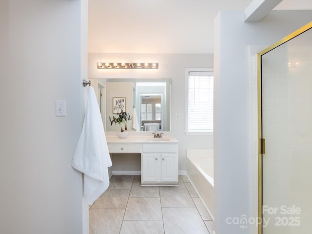 bathroom with tile patterned flooring, vanity, and separate shower and tub