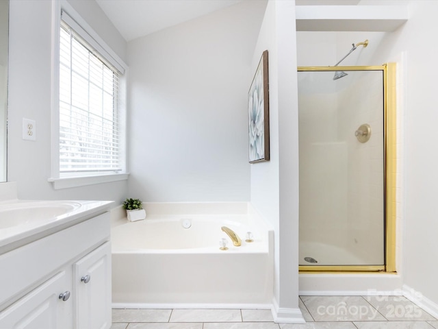 bathroom with tile patterned floors, vanity, and independent shower and bath