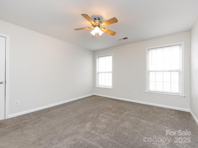 empty room featuring carpet and ceiling fan