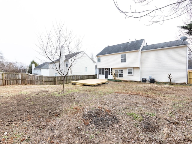 back of property featuring a deck