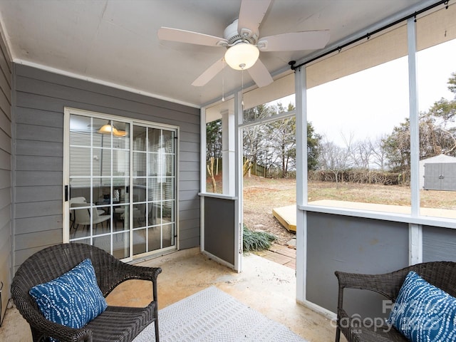 sunroom / solarium with ceiling fan