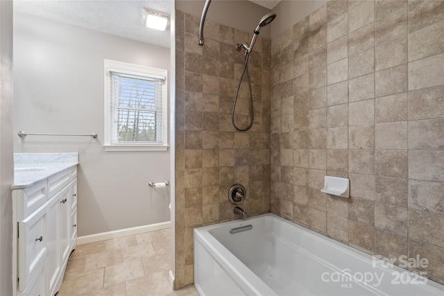 bathroom with vanity and tiled shower / bath combo