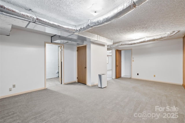 basement featuring light carpet