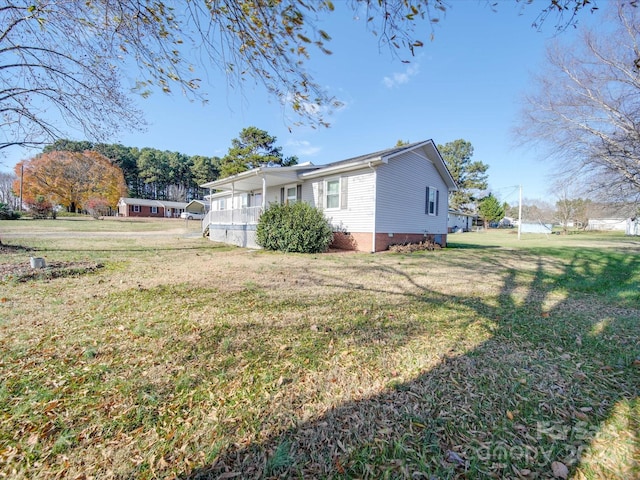 view of property exterior with a lawn