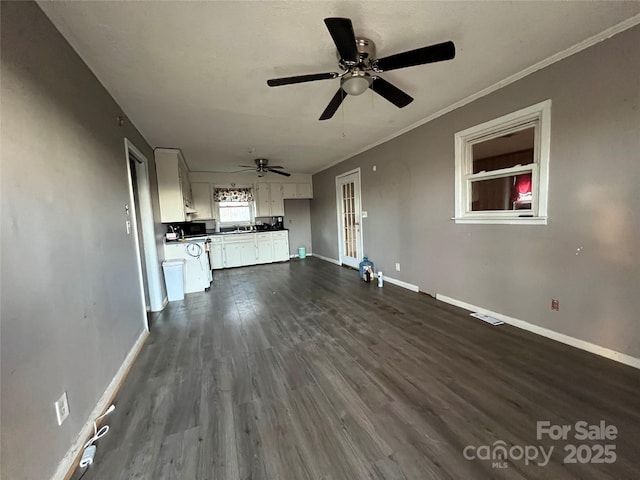 unfurnished living room with french doors, dark hardwood / wood-style flooring, ceiling fan, and ornamental molding