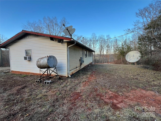 view of side of home with cooling unit