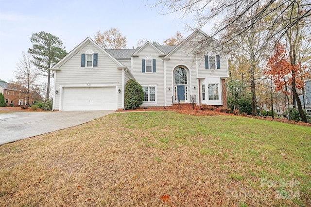 view of front facade with a garage and a front yard