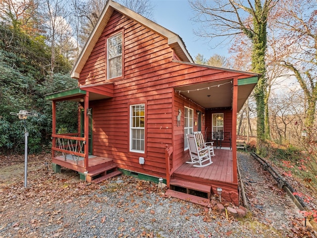 rear view of house with covered porch