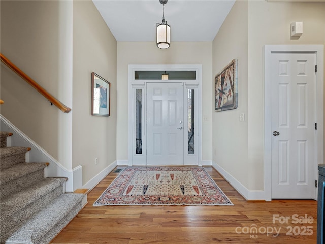 20 Red Plum Ln, Black Mountain, NC 28711 - entrance foyer featuring stairway, baseboards, and wood finished floors