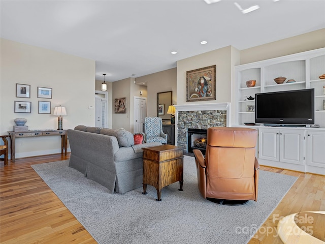 20 Red Plum Ln, Black Mountain, NC 28711 - living room featuring a fireplace, light wood-style flooring, and recessed lighting