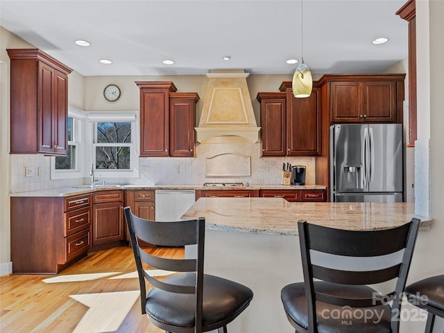 20 Red Plum Ln, Black Mountain, NC 28711 - kitchen featuring a kitchen breakfast bar, stainless steel appliances, a sink, and custom range hood