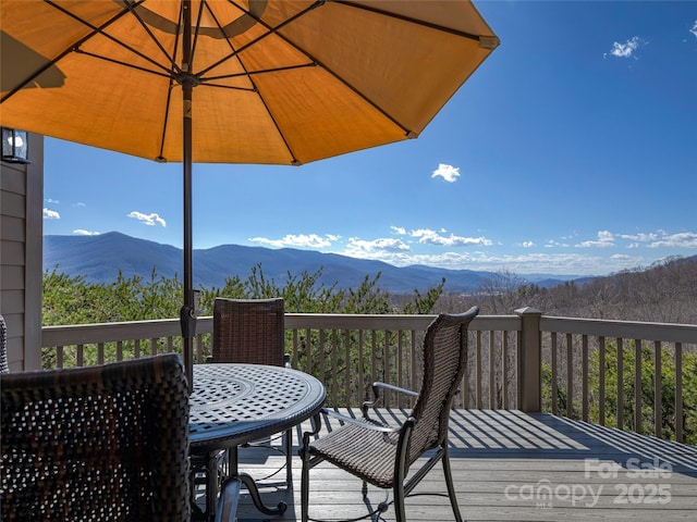 20 Red Plum Ln, Black Mountain, NC 28711 - wooden terrace with outdoor dining area and a mountain view