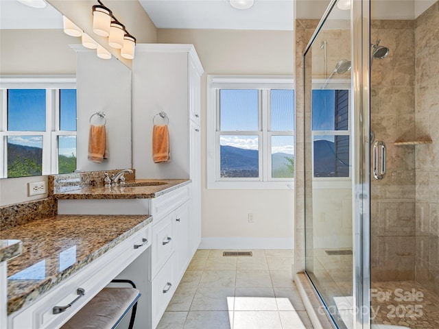 20 Red Plum Ln, Black Mountain, NC 28711 - bathroom featuring a stall shower, baseboards, visible vents, and vanity