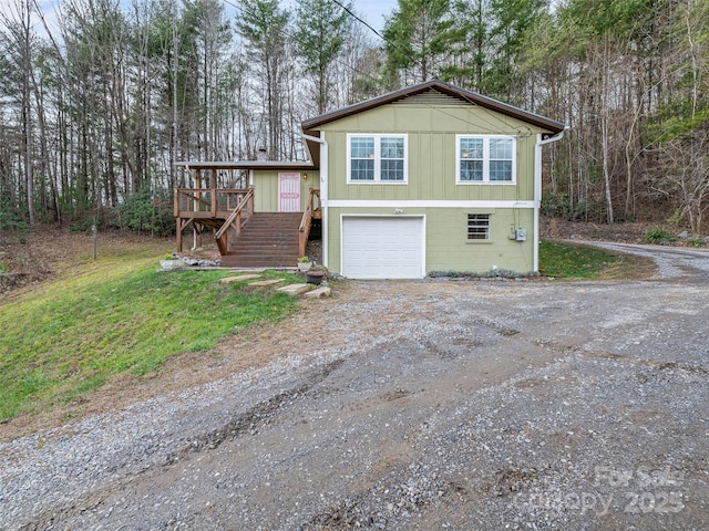 view of front of house featuring a wooden deck and a garage