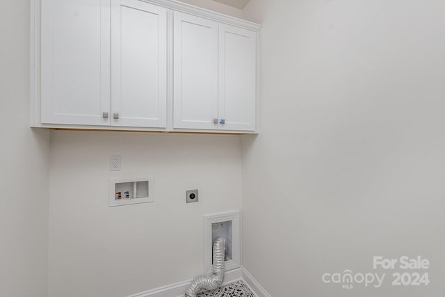 laundry room featuring hookup for a washing machine, cabinets, and hookup for an electric dryer