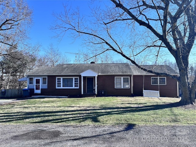 ranch-style home with a front lawn