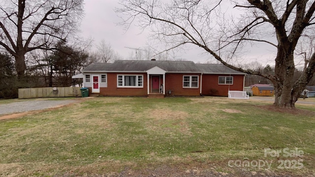 ranch-style home featuring a front yard