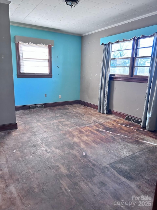 unfurnished room featuring ornamental molding