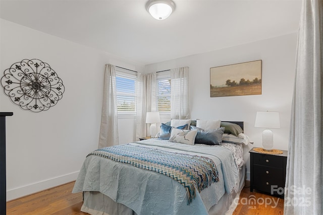 bedroom with hardwood / wood-style flooring