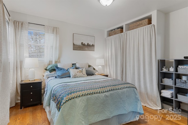 bedroom featuring hardwood / wood-style floors