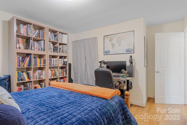 bedroom featuring light wood-type flooring