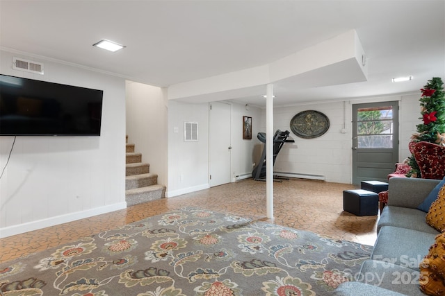 living room with baseboard heating and ornamental molding